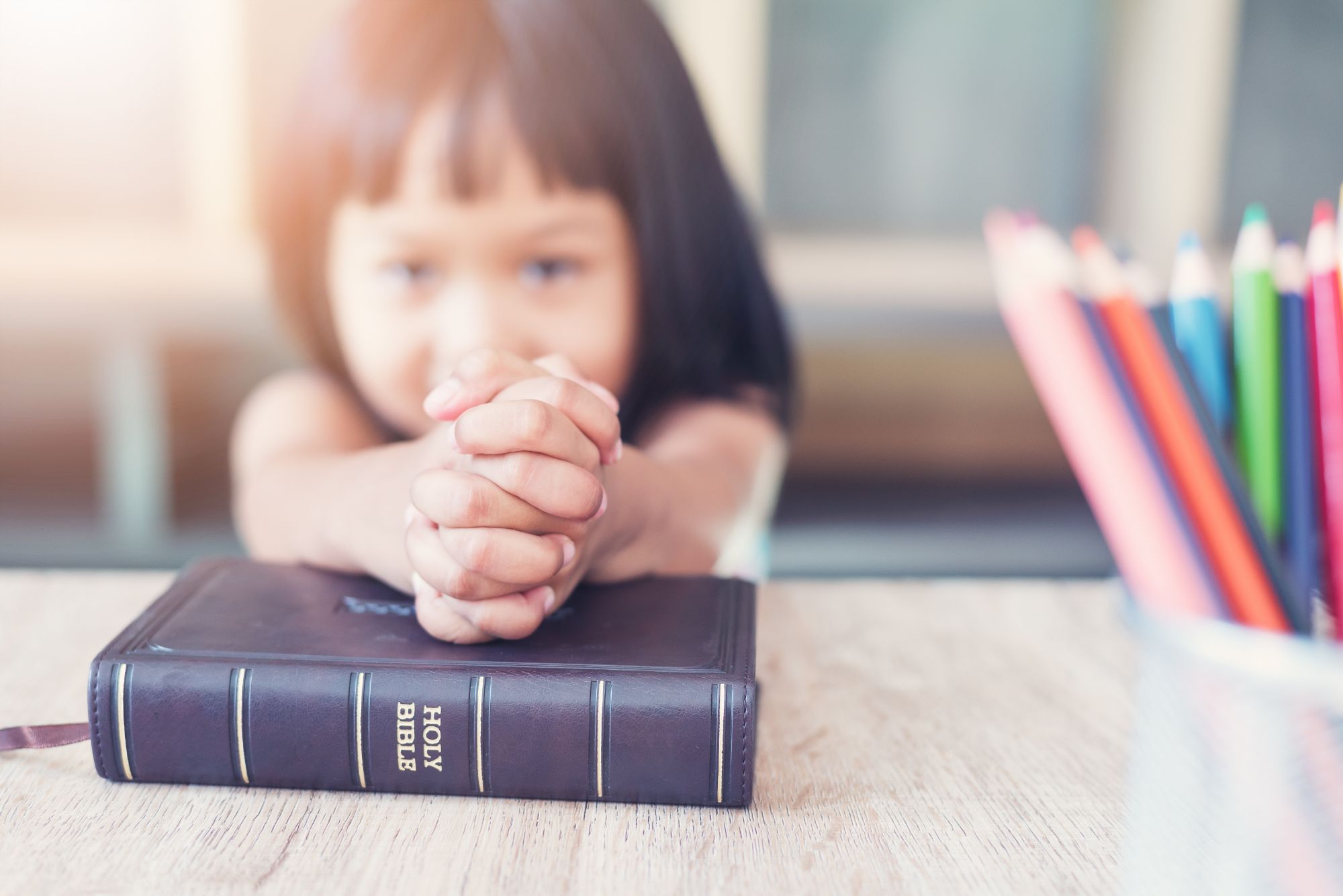 children's sunday school classes you girl praying holding bible